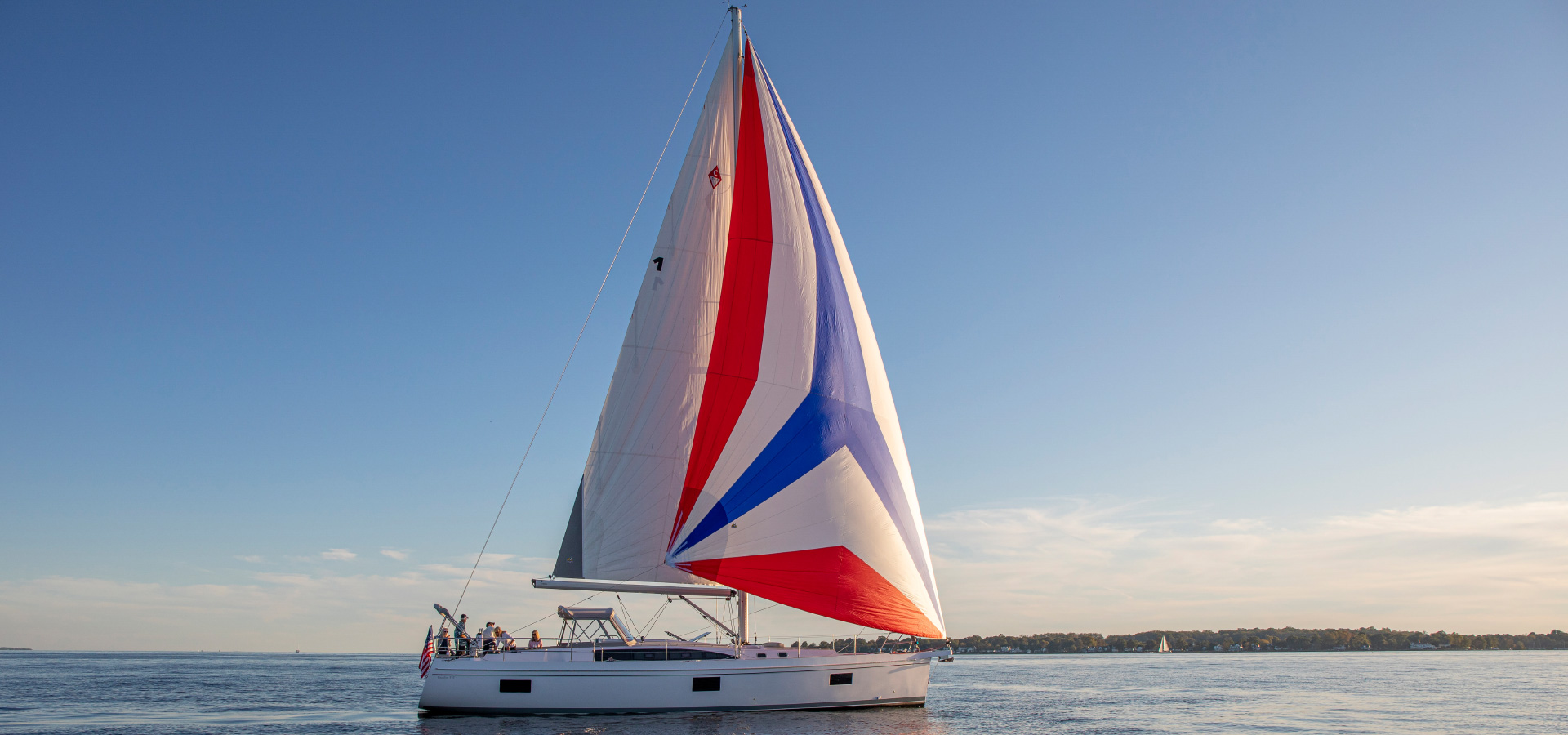 An immaculately maintained Catalina yacht sailing on calm waters under a clear sky, exemplifying the beauty and performance of well-cared-for sailing vessels.